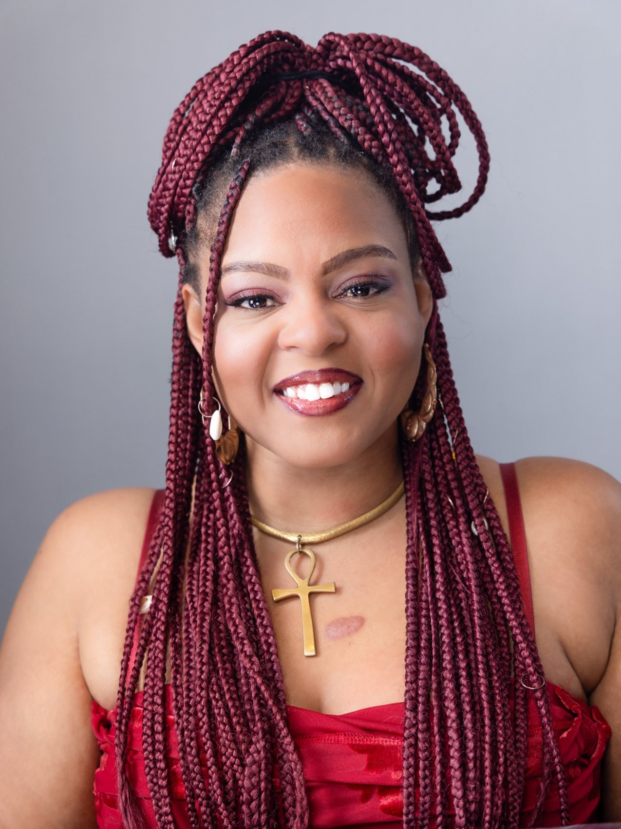 Studio portrait with burgundy braids — MAP Productions portfolio